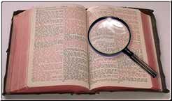 Bible with magnifying glass