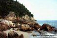 Large rocks at the edge of the ocean shore