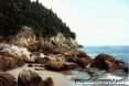 Large rocks at the edge of the ocean shore