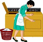 Woman putting laundry in clothes dryer